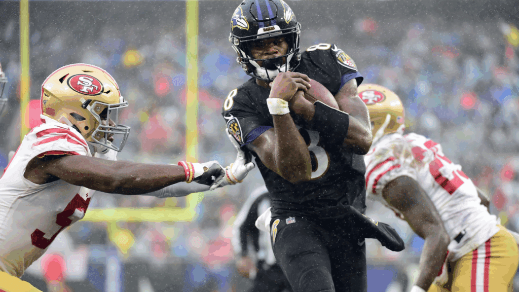 Dec 1, 2019; Baltimore, MD, USA; Baltimore Ravens quarterback Lamar Jackson (8) scores a touchdown in the second quarter against the San Francisco 49ers at M&T Bank Stadium.