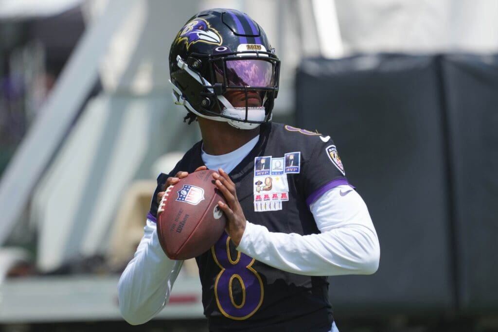 Jul 23, 2025; Owings Mills, MD, USA; Baltimore Ravens quarterback Lamar Jackson (8) warms up during training camp at Under Armour Performance Center.