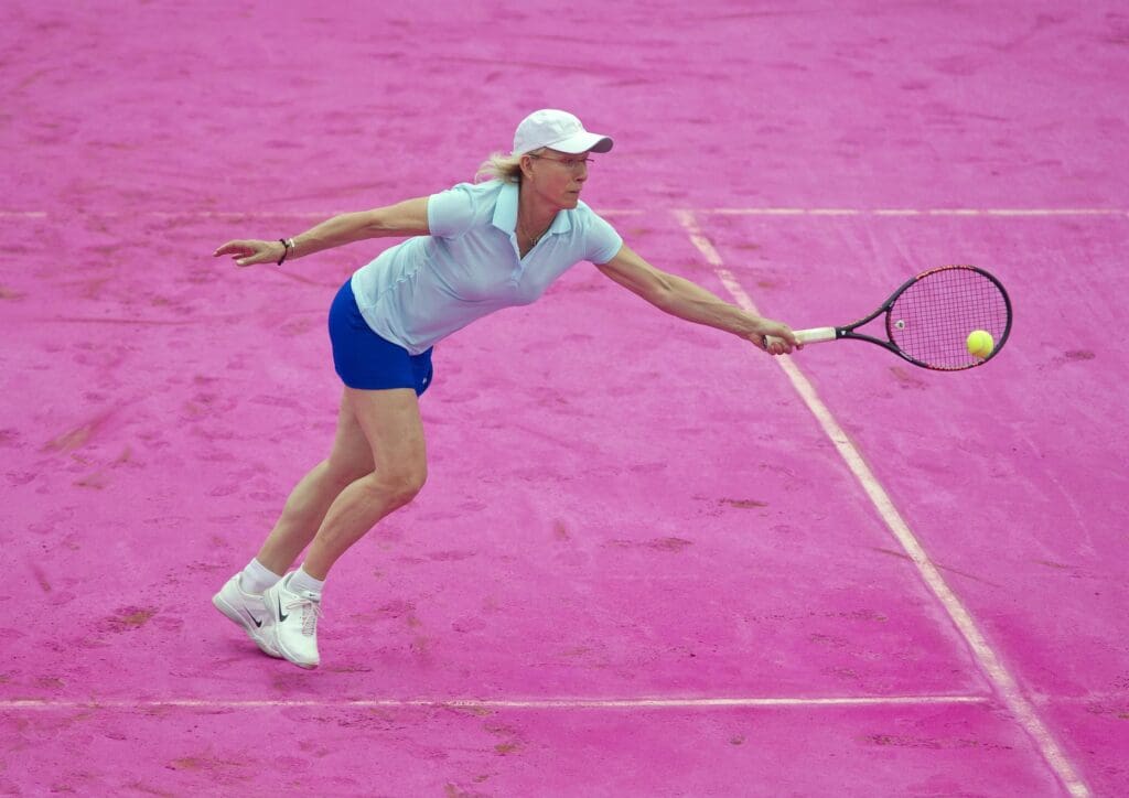 June 7, 2012; Paris, FRANCE; Former tennis player Martina Navratilova plays on the newly resurfaced pink court at Roland Garros. Women had the honor of playing on this one-day-only surface. 