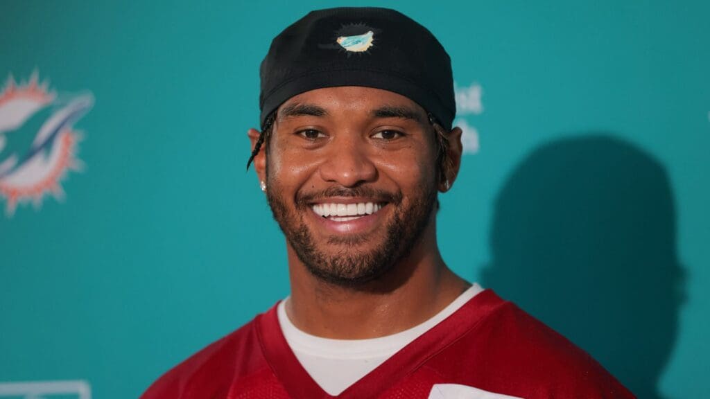 Jul 23, 2025; Miami Gardens, FL, USA; Miami Dolphins quarterback Tua Tagovailoa (1) speaks to reporters during training camp at Baptist Health Training Complex.