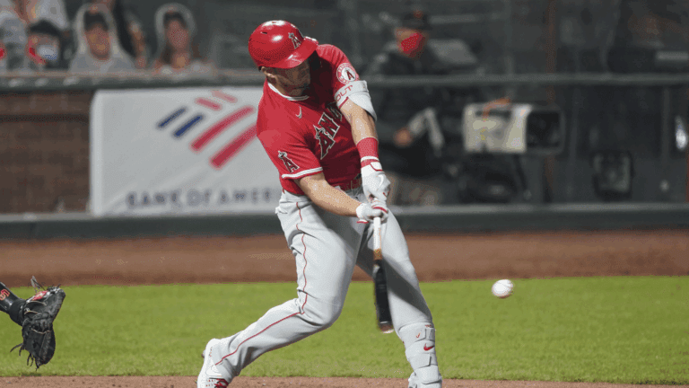 August 20, 2020; San Francisco, California, USA; Los Angeles Angels center fielder Mike Trout (27) hits a triple during the seventh inning against the San Francisco Giants at Oracle Park.