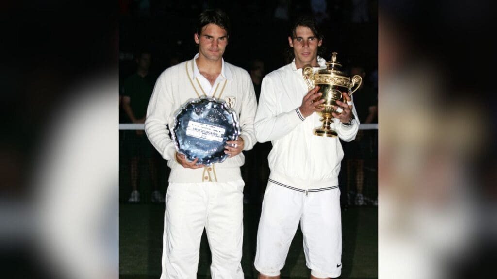 Jul 6, 2008; London, ENGLAND; Rafael Nadal (ESP) poses with the championship trophy after defeating Roger Federer (left with runner up trophy) in the mens finals of the 2008 Wimbledon Championships at the All England Lawn Tennis Club. Nadal defeated Federer 6-4, 6-4, 6-7 (5), 6-7 (8), 9-7.