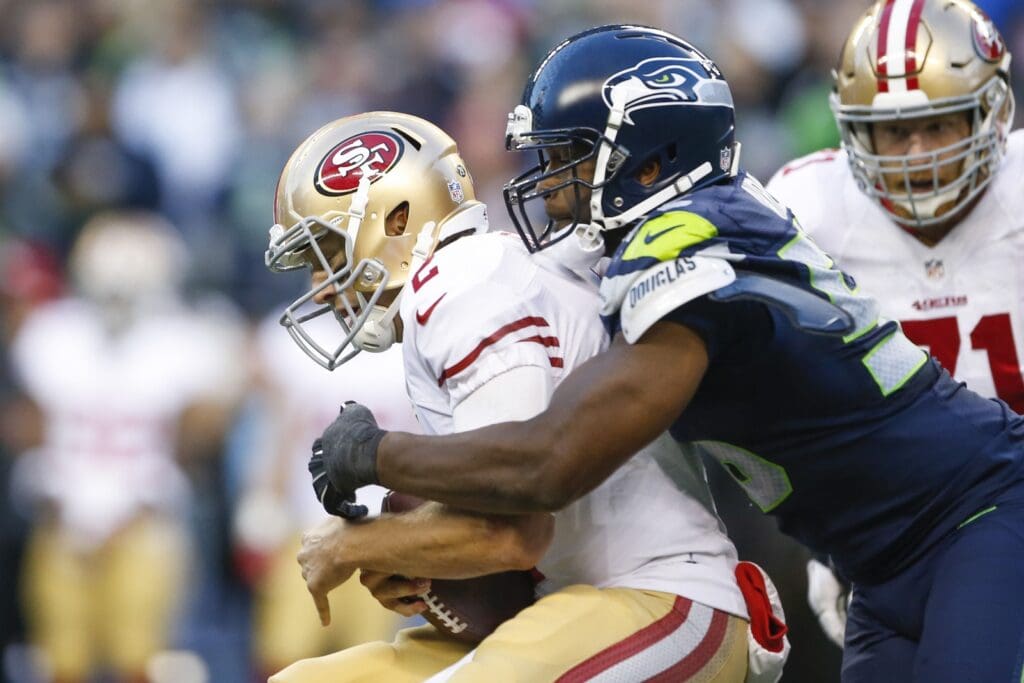 Nov 22, 2015; Seattle, WA, USA; Seattle Seahawks defensive end Cliff Avril (56) sacks San Francisco 49ers quarterback Blaine Gabbert (2) during the fourth quarter at CenturyLink Field. Seattle defeated San Francisco, 29-13. 