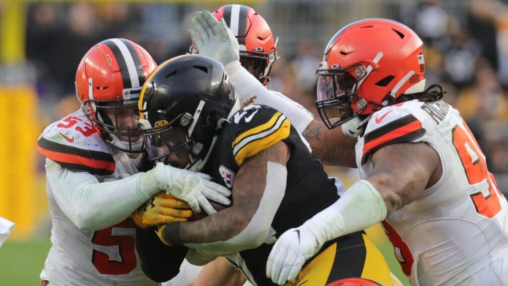Cleveland Browns vs Pittsburgh Steelers' Benny Snell Jr. is swarmed by Cleveland Browns Joe Schoebert, left, Sheldon Richardson, right, and Sheldrick Redwine during a fourth quarter run on Sunday, Dec. 1, 2019 in Pittsburgh, PA, at Heinz Field. The Browns lost the game 20-13. [Phil Masturzo/ Beacon Journal/Ohio.com]