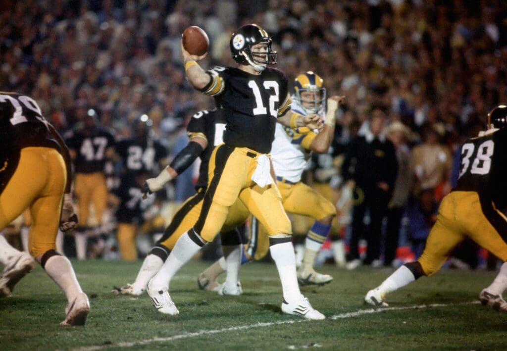 Jan 20, 1980; Pasadena, CA, USA; FILE PHOTO; Pittsburgh Steelers quarterback #12 Terry Bradshaw sets to throw a pass against the Los Angeles Rams during Super Bowl XIV at the Rose Bowl. The Steelers defeated the Rams 31-19. Bradshaw was named the games most valuable player as he was 14 of 21 passing for 309 yards and the Steelers became the first team to win 4 Super Bowls.
