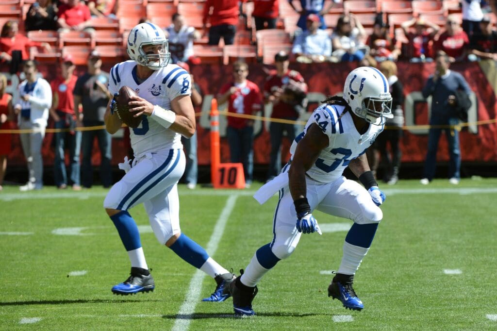 September 22, 2013; San Francisco, CA, USA; Indianapolis Colts running back Trent Richardson (34) runs past quarterback Matt Hasselbeck (8) before the game against the San Francisco 49ers at Candlestick Park. The Colts defeated the 49ers 27-7.