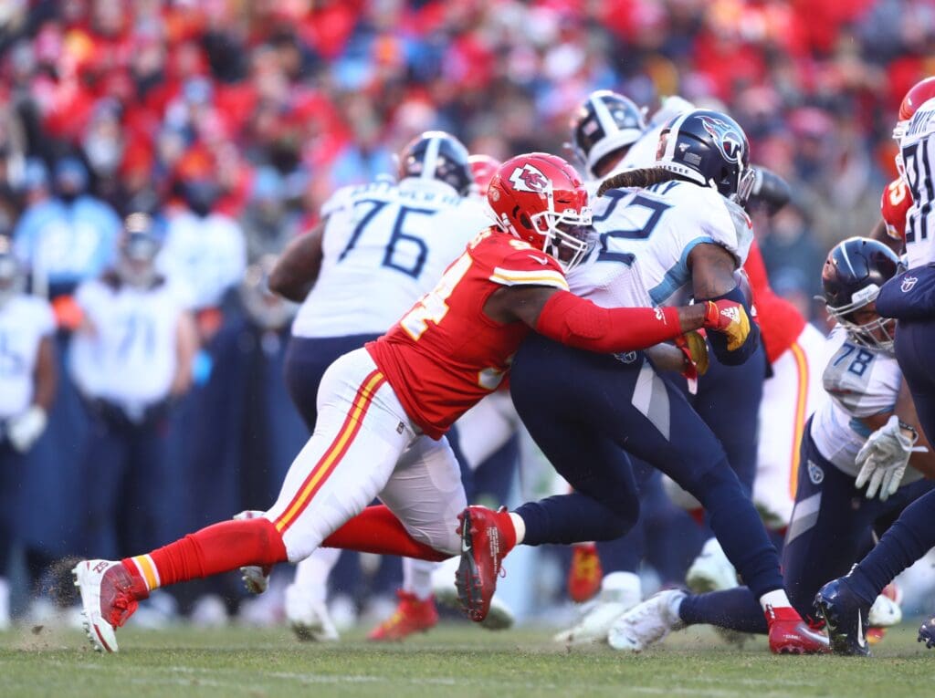 Jan 19, 2020; Kansas City, Missouri, USA; Kansas City Chiefs defensive end Terrell Suggs (94) tackles Tennessee Titans running back Derrick Henry (22) in the AFC Championship Game at Arrowhead Stadium. Mandatory Credit: Mark J. Rebilas-USA TODAY Sports