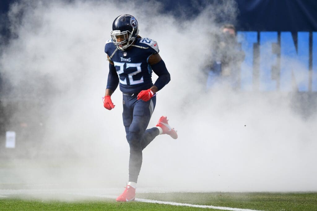 Jan 10, 2021; Nashville, Tennessee, USA; Tennessee Titans running back Derrick Henry (22) runs onto the field during pregame introductions before a AFC Wild Card playoff game against the Baltimore Ravens at Nissan Stadium. Mandatory Credit: Christopher Hanewinckel-USA TODAY Sports