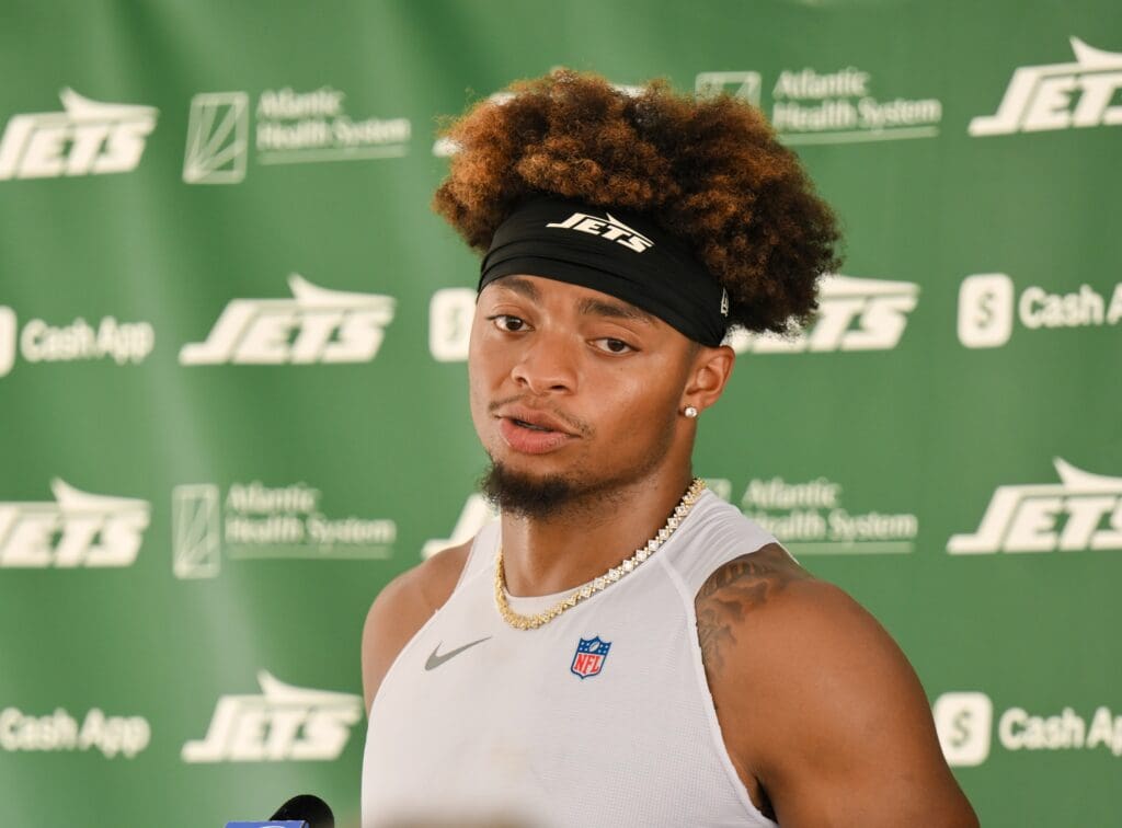 Jul 23, 2025; Florham Park, NY, USA; New York Jets quarterback Justin Fields (7) speaks at a press conference during training camp at Atlantic Health Jets Training Center. Mandatory Credit: John Jones-Imagn Images