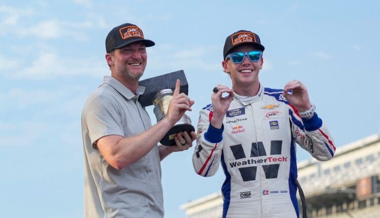 Dale Earnhardt Jr. smiles for a photo with NASCAR Xfinity Series driver Connor Zilisch (88) on Saturday, July 26, 2025, after winning the Pennzoil 250 at Indianapolis Motor Speedway.