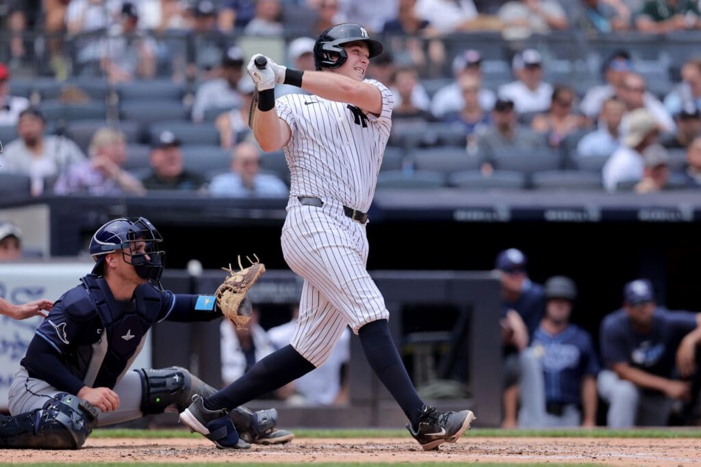 Jul 31, 2025; Bronx, New York, USA; New York Yankees catcher Ben Rice (22) follows through on a three run home run against the Tampa Bay Rays during the second inning at Yankee Stadium. Mandatory Credit: Brad Penner-Imagn Images