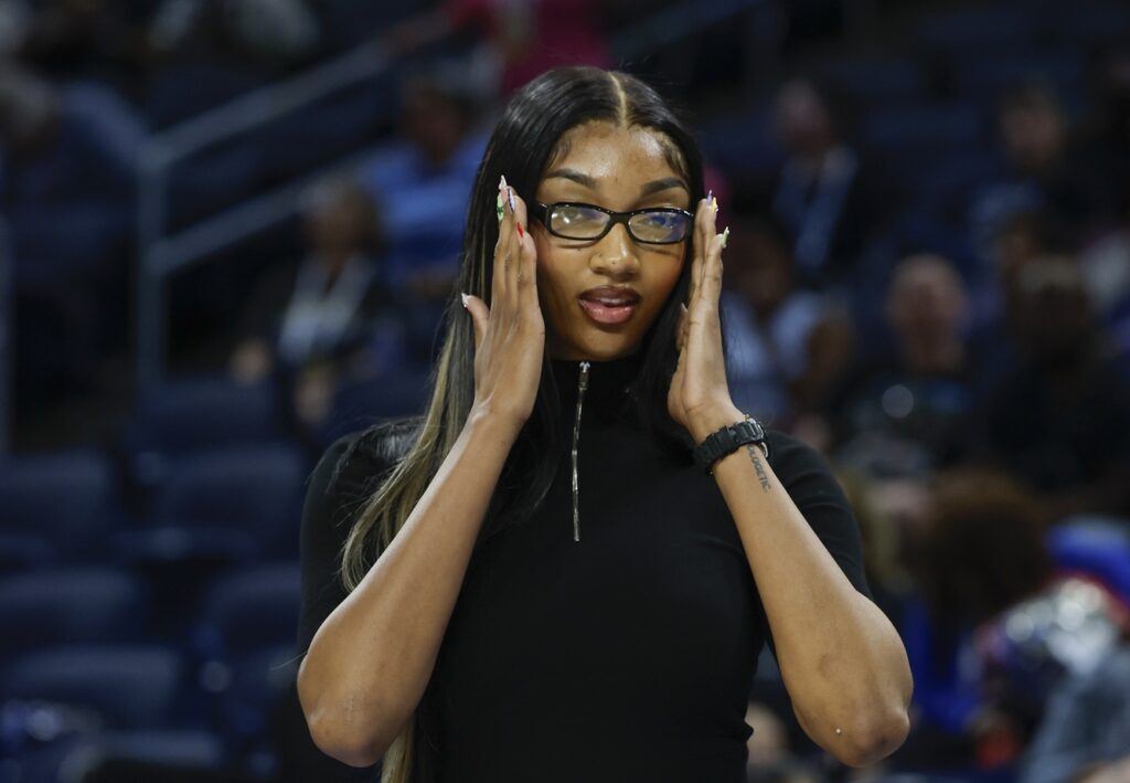 Aug 3, 2025; Chicago, Illinois, USA; Injured Chicago Sky forward Angel Reese (5) stands on the sidelines before a WNBA game against the Phoenix Mercury at Wintrust Arena. Mandatory Credit: Kamil Krzaczynski-Imagn Images