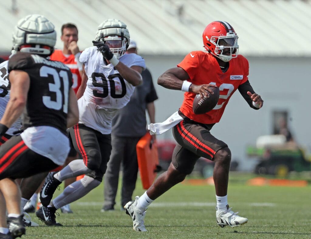 Browns quarterback Shedeur Sanders runs for a short gain during training camp, July 30, 2025, in Berea.