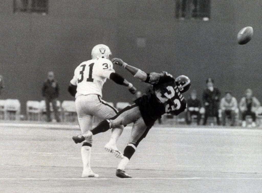 Dec 23, 1972; Pittsburgh, PA, USA; FILE PHOTO; Pittsburgh Steelers running back John Fuqua (33) is hit by Oakland Raiders defensive back Jack Tatum (31) as the ball is deflected after a pass from Terry Bradshaw (not pictured) and caught by Franco Harris (not pictured) who scored the winning touchdown in the 1972 AFC Divisional Playoff Game against the Oakland Raiders at Three Rivers Stadium. The Steelers defeated the Raiders 13-7. The catch was deemed the "Immaculate Reception" when Harris (not pictured) caught a deflected pass with 5 seconds left in the game to give the Steelers the victory. Mandatory Credit: Dick Raphael-USA TODAY Sports Images