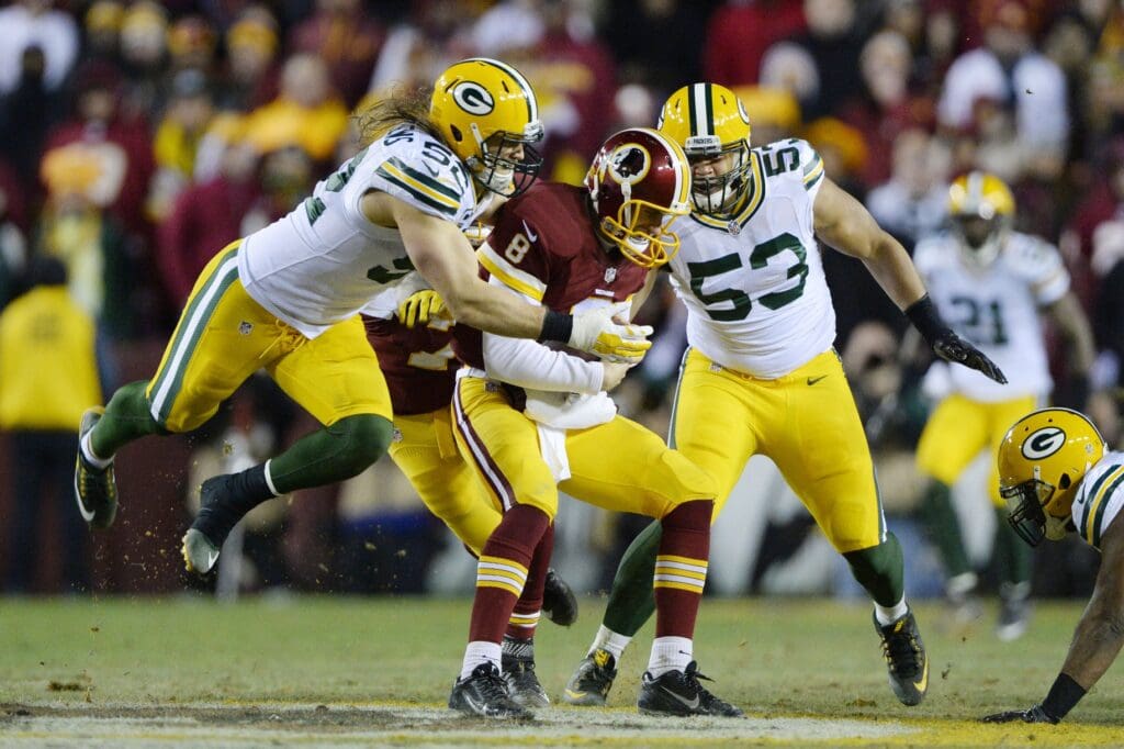 Jan 10, 2016; Landover, MD, USA; Green Bay Packers inside linebacker Clay Matthews (52) and Green Bay Packers outside linebacker Nick Perry (53) sack Washington Redskins quarterback Kirk Cousins (8) during the second half in a NFC Wild Card playoff football game at FedEx Field. Mandatory Credit: Brad Mills-USA TODAY Sports