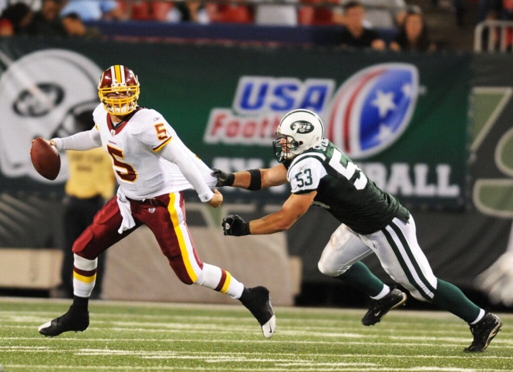 Aug 16, 2008; East Rutherford, NJ, USA; Washington Redskins quarterback Colt Brennan (5) attempts to escape a sack by New York Jets linebacker Cody Spencer (53) during a preseason game at Giants Stadium.