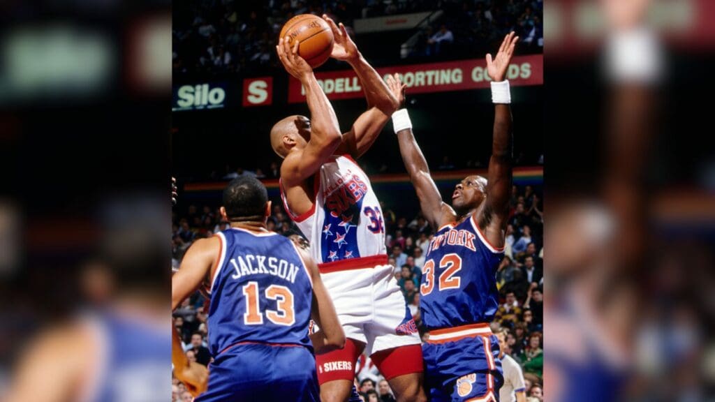 Unknown date; Philadelphia, PA, USA; FILE PHOTO; Philadelphia 76ers forward Charles Barkley (32) shoots over New York Knicks forward Xavier McDaniel (32) at the Spectrum